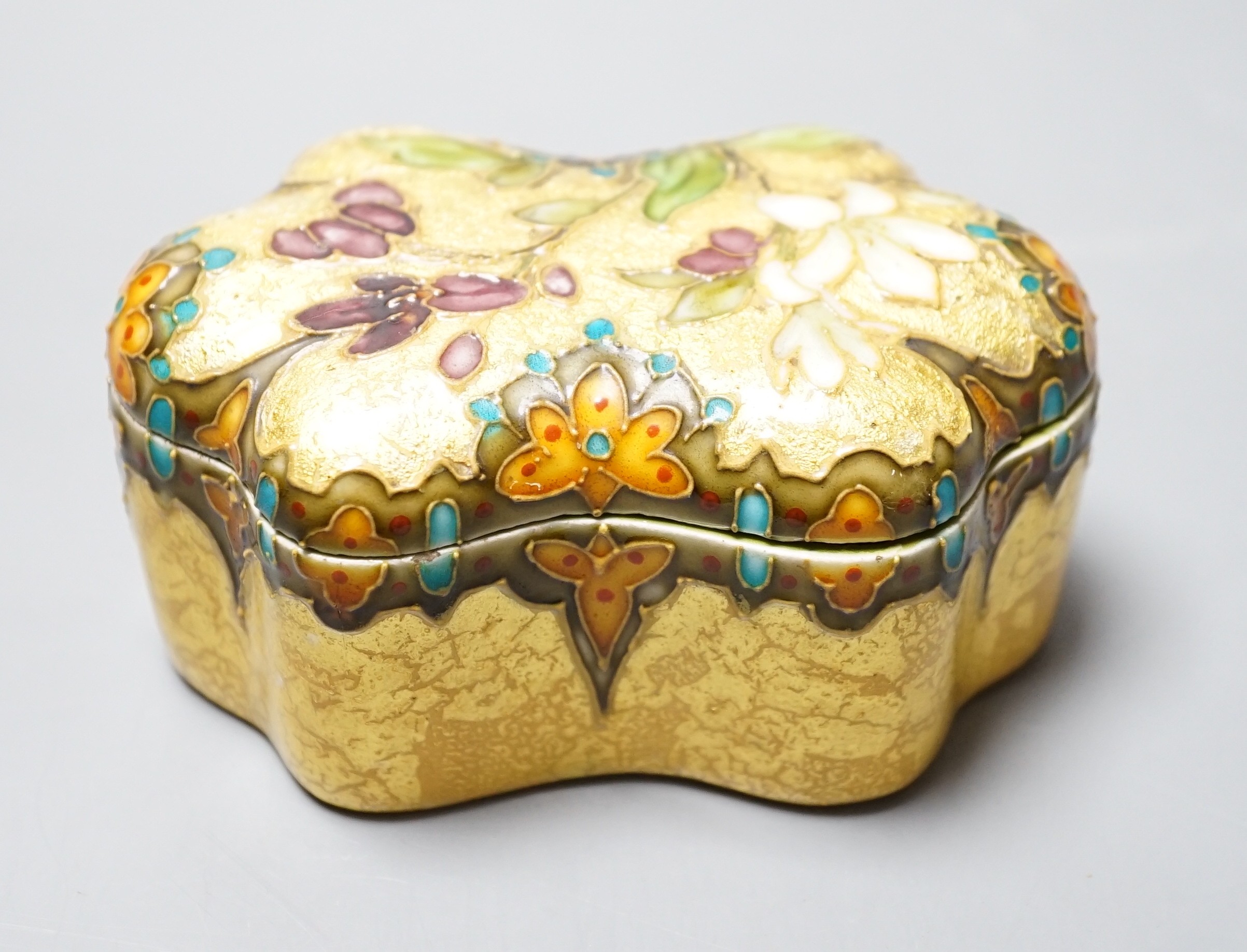 A Clement Massier, Golfe Juan box with enamelled floral decoration on ground yellow base, 9.5cm, original paper labels